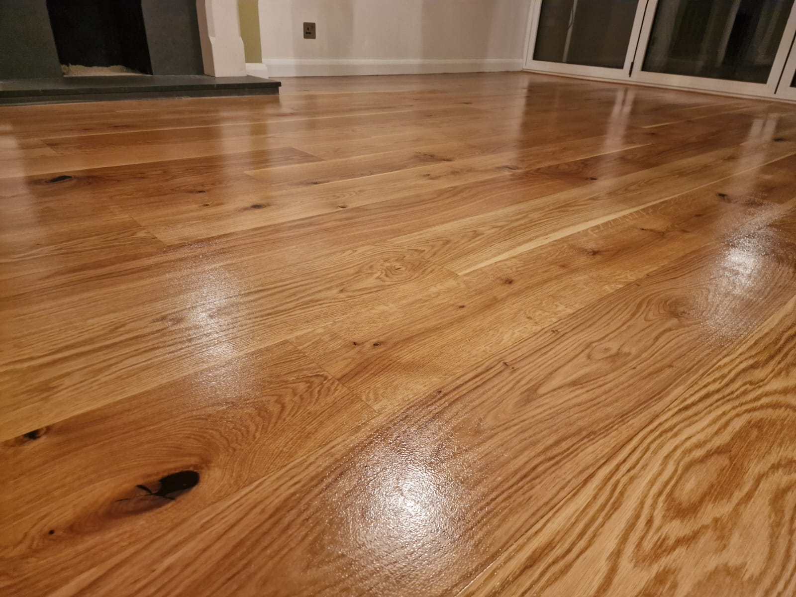 Commercial Floor Sanding in Upminster: beautifully restored oak plank hardwood flooring with a smooth, polished finish after sanding and sealing.